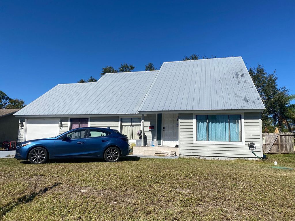 Photo of 871 SE Carnival Avenue Ave, Port St Lucie, FL 34983 (MLS # R10769950)