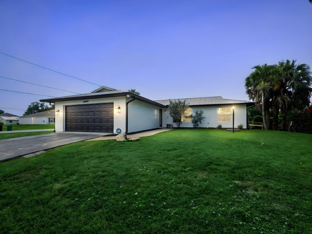 Photo of 2501 SW Beverly Street, Port Saint Lucie, FL 34953 (MLS # R11107845)