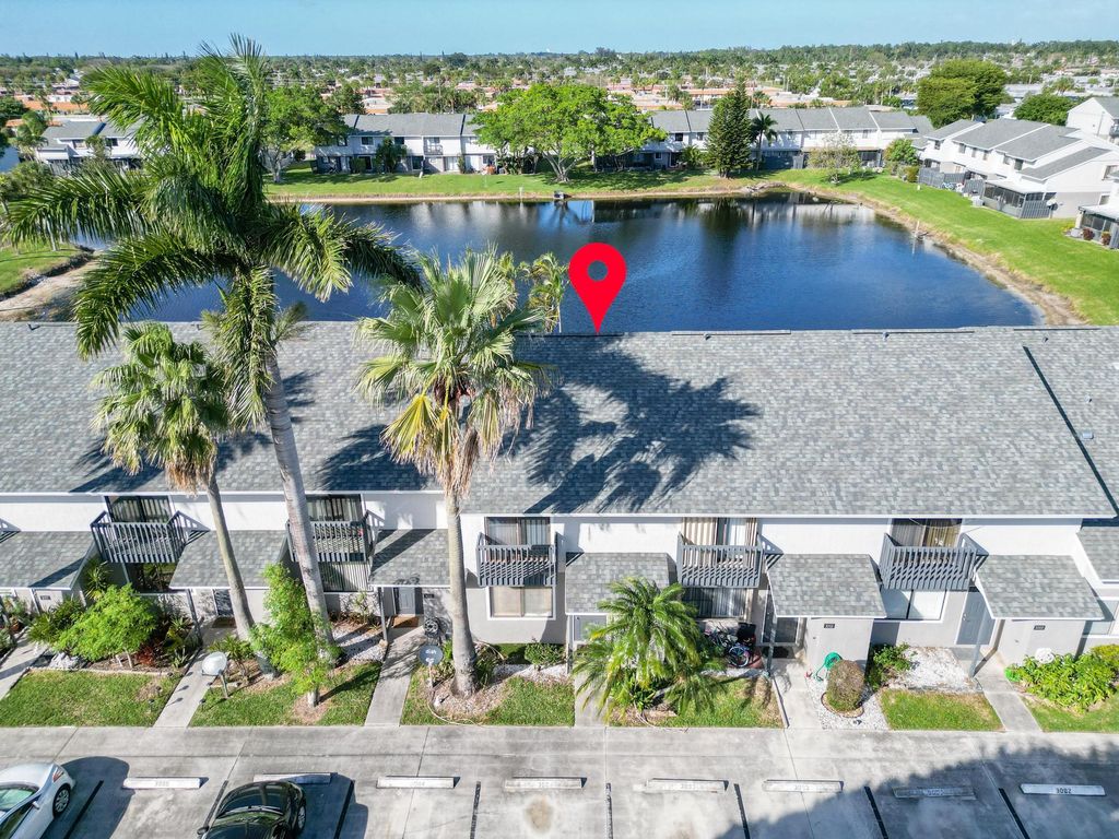 Photo of 3004 Poolside Drive, Greenacres, FL 33463 (MLS # R10958052)