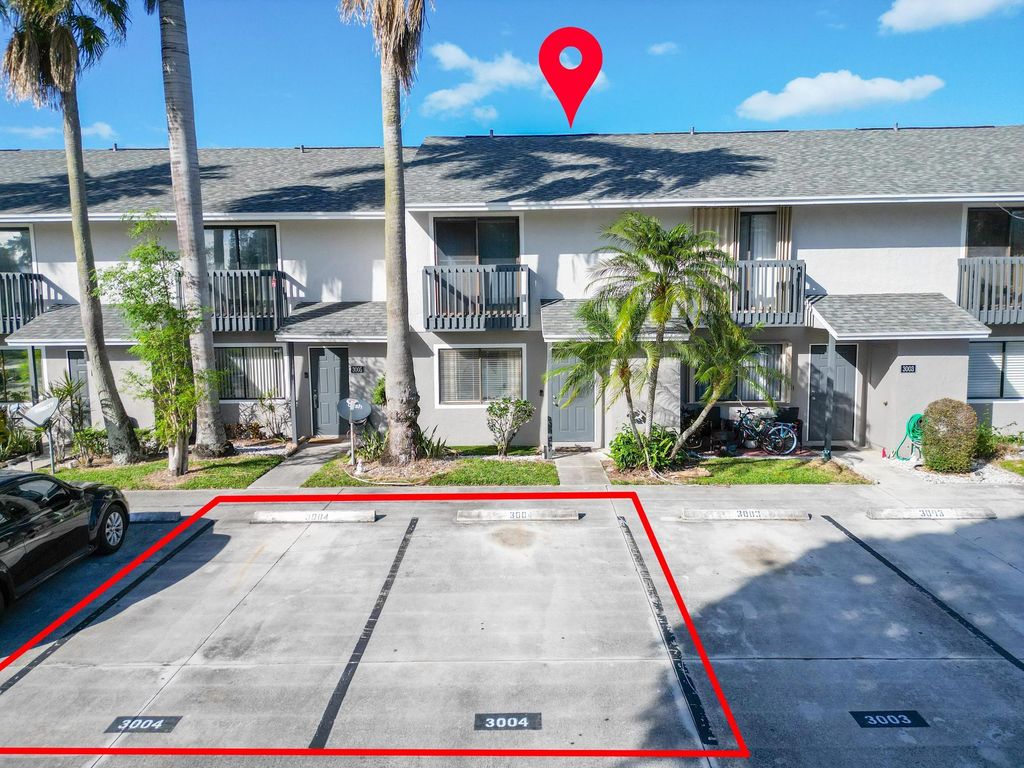 Photo of 3004 Poolside Drive, Greenacres, FL 33463 (MLS # R10958052)