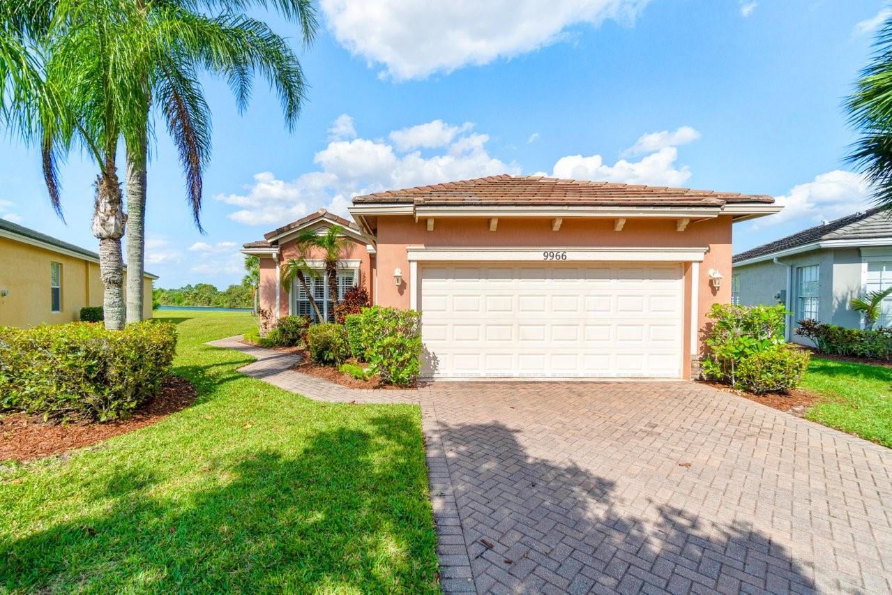 Welcome to the" Twins Waters Preserve" Heritage Oaks 3bed 2bath home nestled in the much sought after guard-gated Tradition. First floor entry leads to a spacious living room overlooking tranquil waters and unblocked preserve. With enough room for a pool the backyard can be enjoyed from the spacious screened in oversized patio. Granite counter tops and a breakfast nook complements a kitchen full of storage space and a separate laundry room. The spacious master bedroom overlooks the water and preserve has a walk-in closet and a double sink bathroom. Plantation shutters through out. Low HOA includes lawn maintenance, pest control,basic cable, high speed internet, a pool, fitness center and a fully kitchen gathering lounge completes this all ages,pet friendly community.