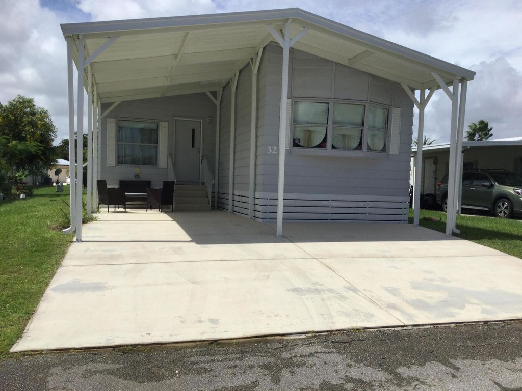 Photo of 32 Flamenco Way, Port Saint Lucie, FL 34952 (MLS # R11130003)