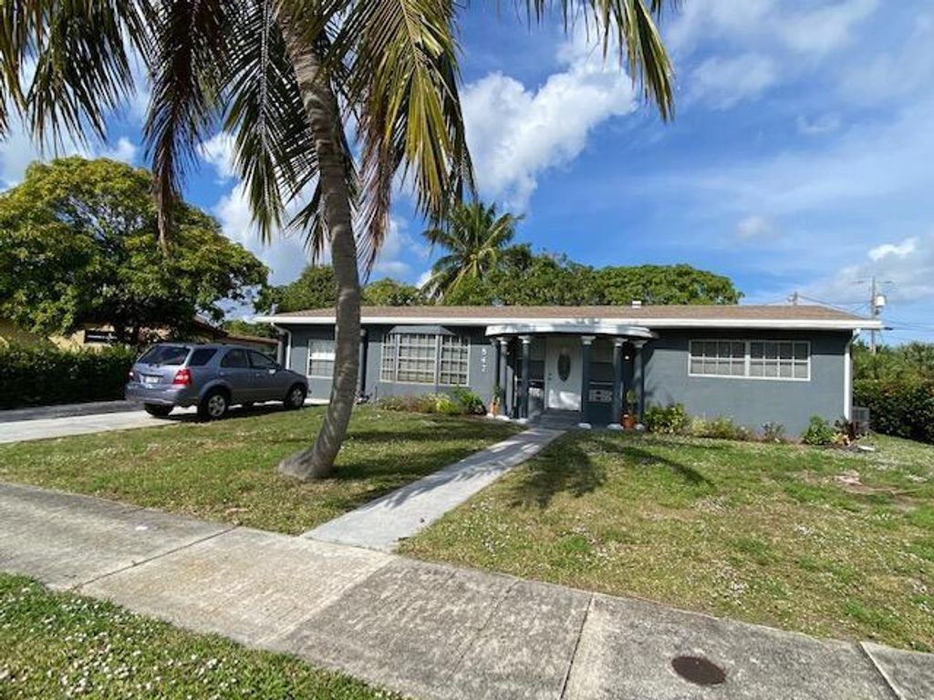 Photo of 847 Evergreen Drive, Lake Park, FL 33403 (MLS # R10765255)