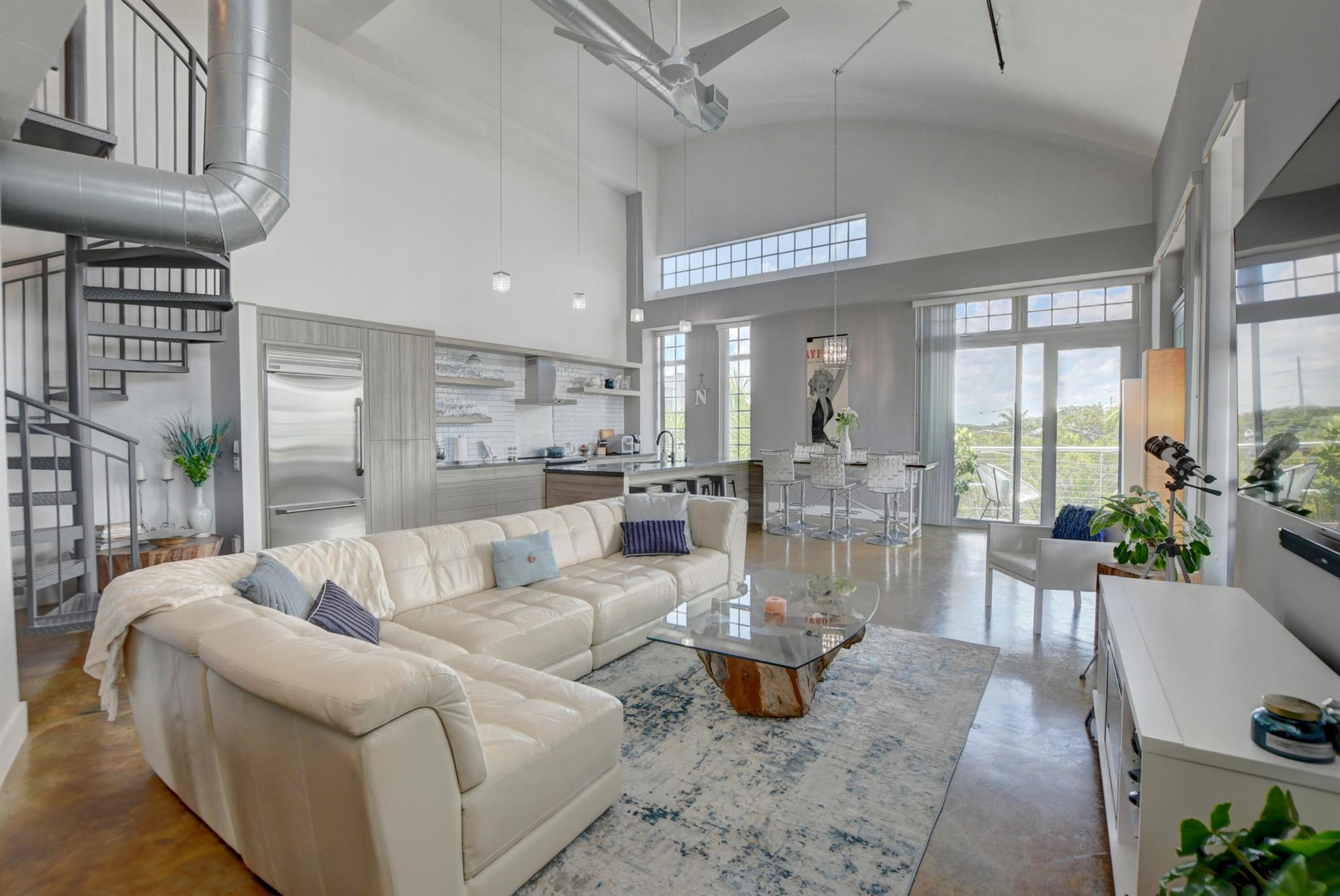 Stunning corner penthouse loft in East Delray Beach - short walk to Atlantic Ave, the beach, shops/restaurants/nightlife. Dramatic vaulted ceilings, feels like a single family home in the sky.Extra large impact glass windows for lots of natural light. Impeccably decorated residence, top notch chef's kitchen, and numerous upgrades throughout. Additional den area on the 2nd floor can be used for office, lounge, or extra sleeping area. Large outside balconies/terraces add additional significant space to the already huge interior. Great space/layout for entertaining. Elevator down to 2 deeded garage spots.HOA amenities include resort style pool area with hot tub and recreational area. One of the best units in the HOA--OUTSIDE WRAP AROUND CORNER BALCONY/TERRACE. Available NOV 1-January 31 only