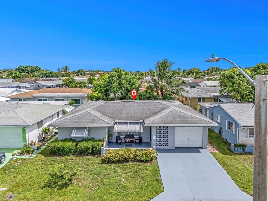 Mainlands in Tamarac 55+ Community is a lovely place to live. Offers 2 Heated Community Pools, Clubhouse, Billiards Room, Library, Shuffle Board, On site office and Community Events. VERY LOW ASSOCIATION FEE. This home Features 2 Oversized Bedrooms and 2BA and the VERY Large Florida Room. The Largest Model Offered with 1669sf Under Air and 1707sf Adjusted area. Updated Kitchen, SSL, Granite and Glass Tile Backsplash. Both Bathrooms are Beautifully Updated, Primary has Walk-In Shower. Primary Bedroom has New Tile Floor and Walk In Closet. There are New Ceiling Fans and light fixtures though the home. Brand New flat roof (2024) over Florida Room, AC 2025, Roof 2013, Flat Roof (2024) New Entry Door, Side doors and Garage Door, Storm Shutters on all the windows. Please see the Application Package for Mainlands Sec 6 and Policies.