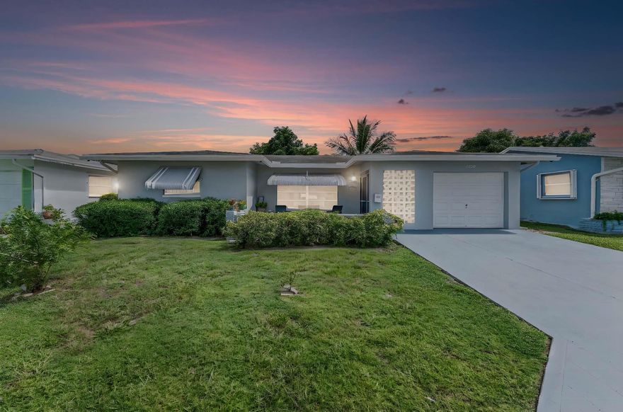 Mainlands in Tamarac 55+ Community is a lovely place to live. Has 2 Community Pools, Clubhouse, Several Amenities and the Association cares for the Sprinklers and Lawn Maintenance. This home Features 2BR and 2BA and the Exceedingly Large Florida Room. Larger model home with 1669sf Under Air and 1707sf Adjusted area. Updated Kitchen has SSL Granite and Glass Tile Backsplash. Both Bathrooms are Beautifully Updated, both have been retiled, Primary has Walk-In Shower. Primary Bedroom has new tile floors. There are New Ceiling Fans and light fixtures though the home. Brand New flat roof over Florida room, AC 2025, Roof 2013. Hurricane Grade Entry Door, Side doors and Garage Door, Storm Shutters on all the windows.