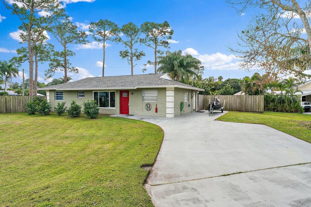 Photo of 5854 SE Orange Blossom Trail, Hobe Sound, FL 33455 (MLS # R11007578)