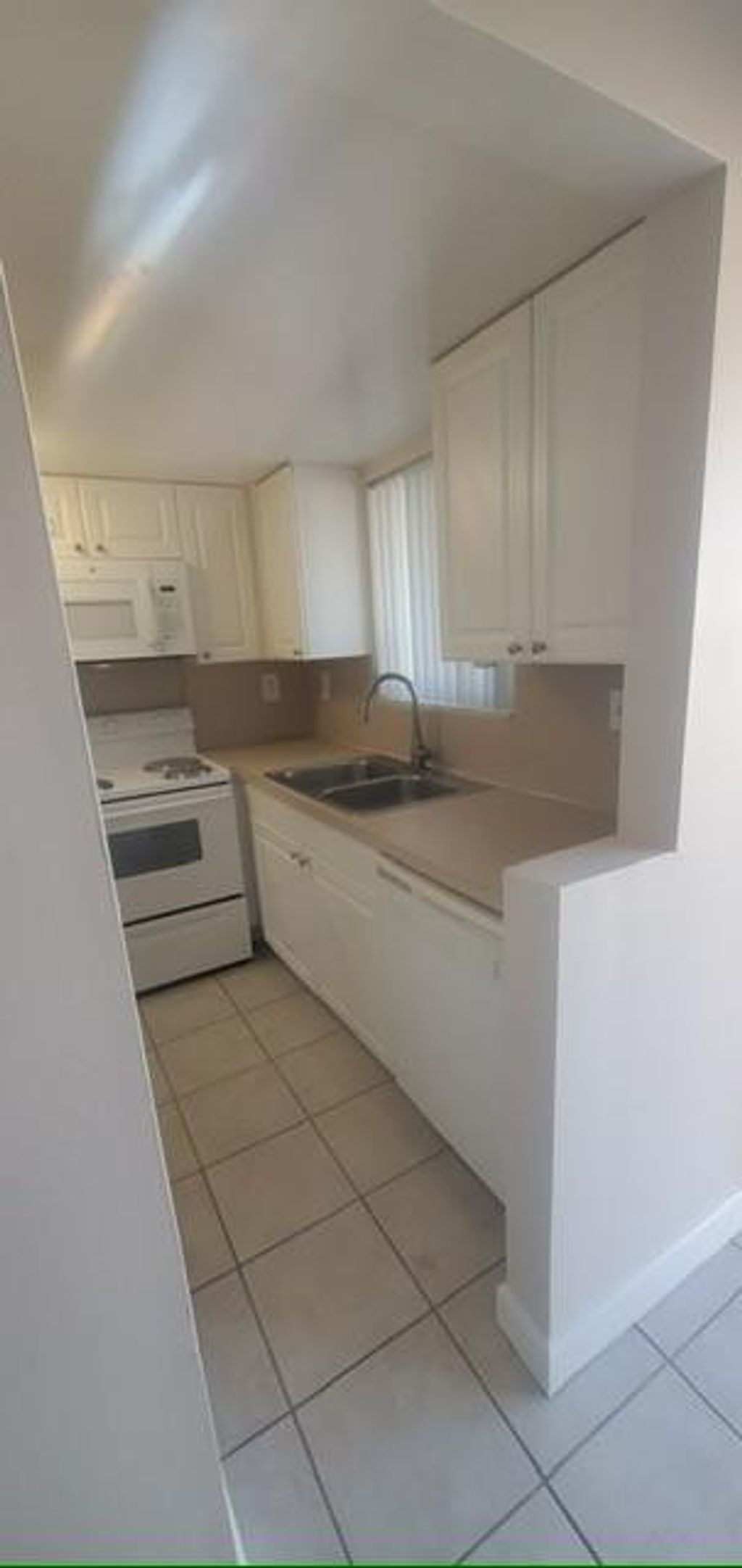 Photo of 1501 Crescent Cir #B14, Lake Park, FL 33403 (MLS # F10539678)