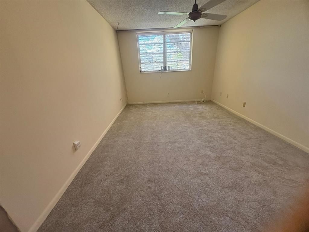 Photo of 6001 NW 61st Ave #105, Tamarac, FL 33319 (MLS # F10540039)