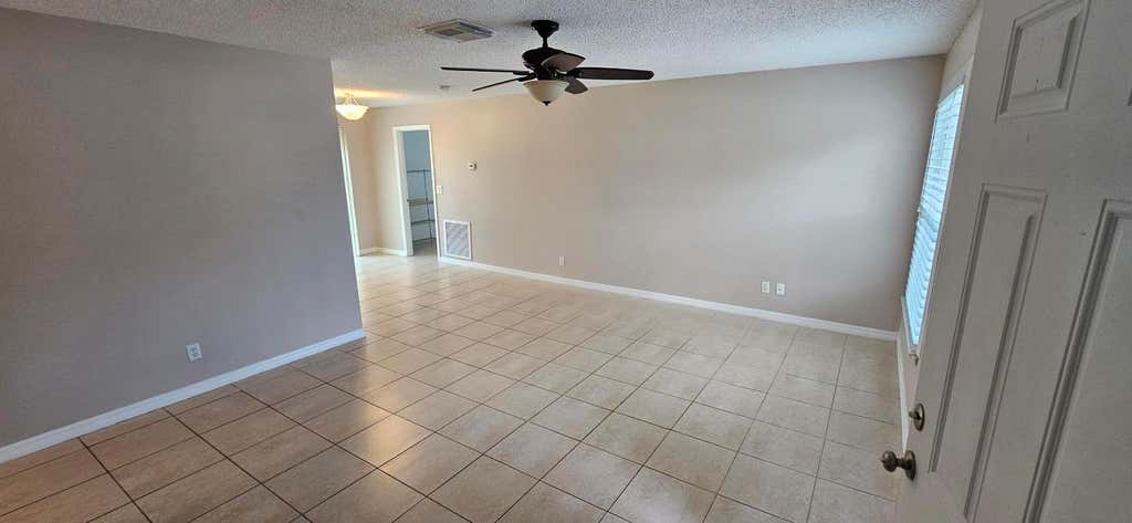 Photo of 1729 SW Taurus Lane, Port Saint Lucie, FL 34984 (MLS # R10962618)