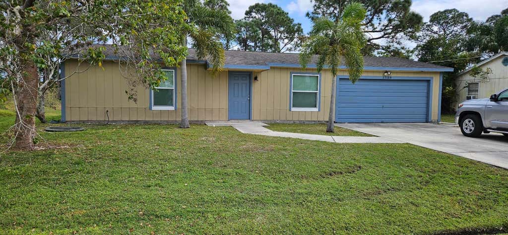 Photo of 1729 SW Taurus Lane, Port Saint Lucie, FL 34984 (MLS # R10962618)
