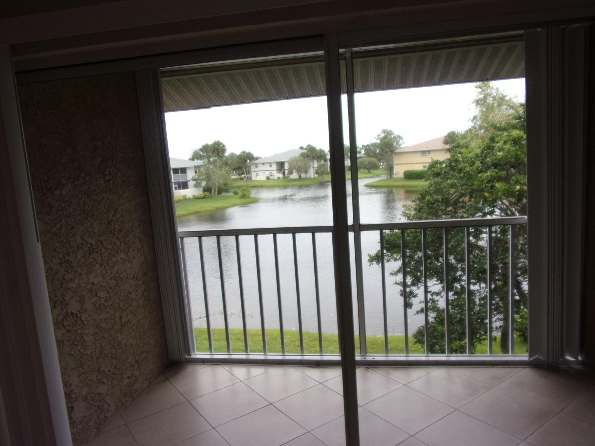 Beautifully updated two bedroom, two bathroom apartment with stainless steel appliances, granite kitchen countertops, ceramic tiles throughout, including the screened balcony overlooking a lake with a fountain. Prime location and just steps to the community pool. A MUST SEE! **PLEASE READ**1st month $1,800.00+ $3,600.00 Security Deposit= $5,400.00, renters insurance & utilities transferred to tenants name required for move-in. Requirements: Good payment history in Credit Report, Gross Income needs to be close to 3 times the rent ($5,400.00). HOA approval is also needed to rent in community.