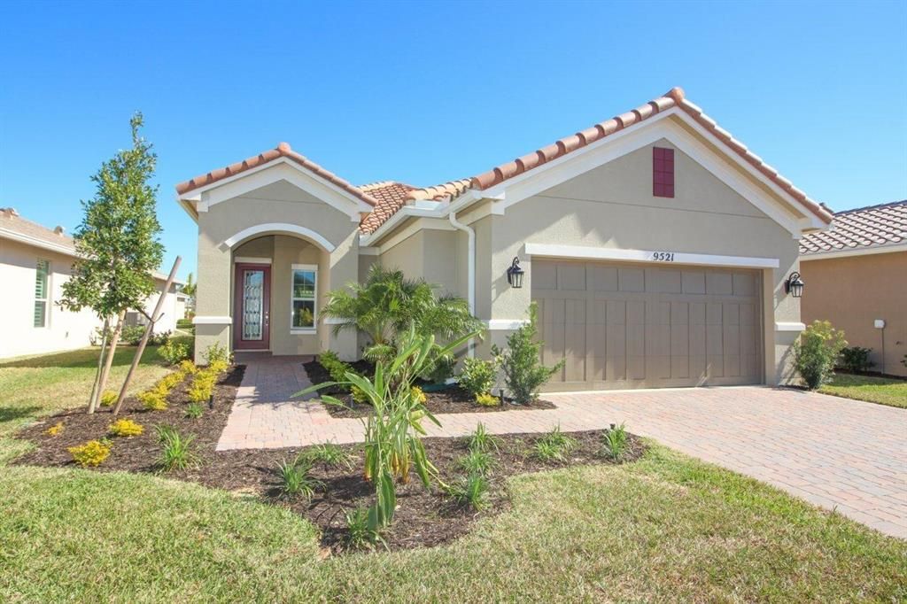 Photo of 9521 SW Royal Poinciana Drive, Port Saint Lucie, FL 34987 (MLS # R10688103)
