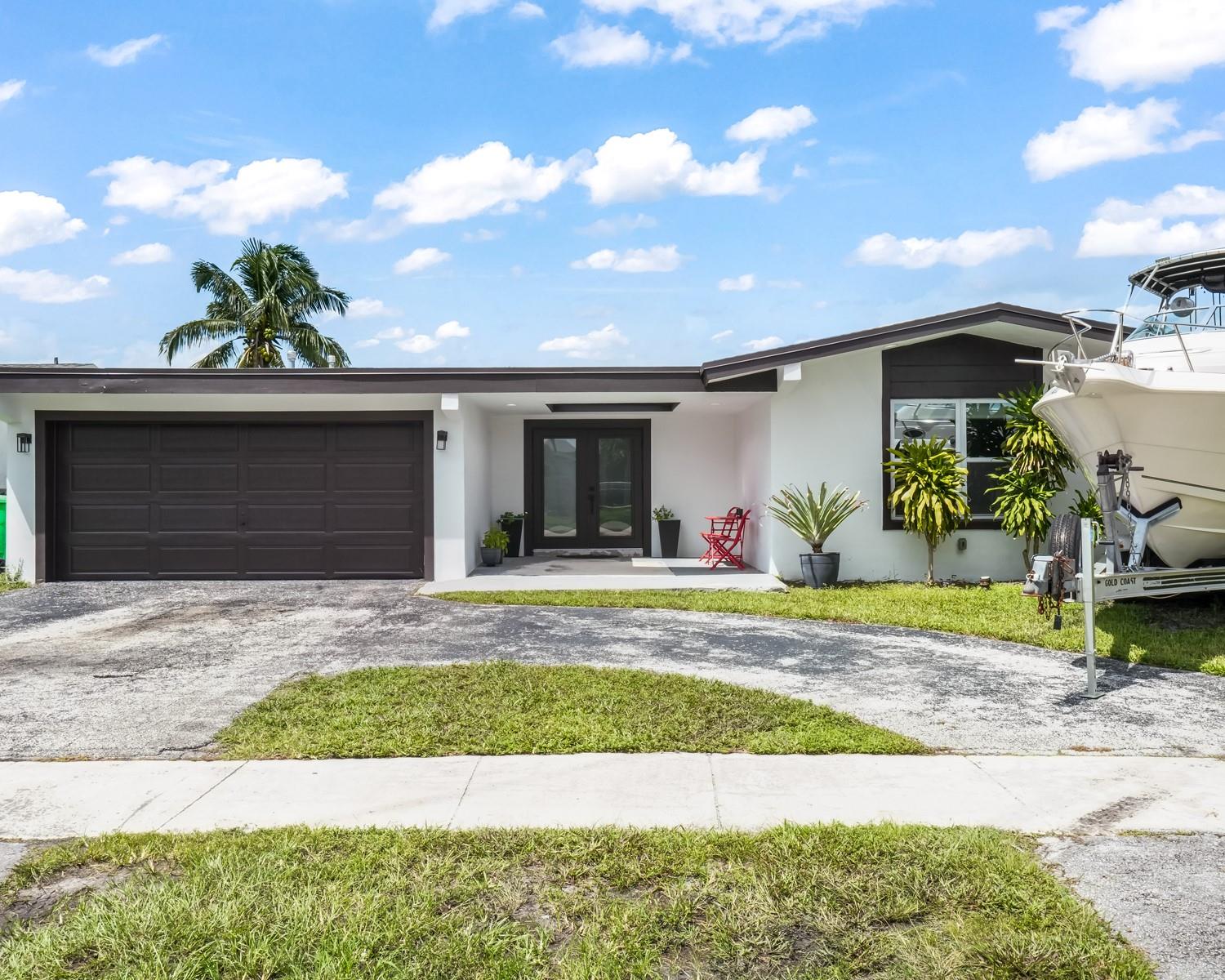 Discover this exquisite 4 bed, 3 bath modern- contemporary home in Sunrise, FL situated on the canal. No HOA, and no rental restrictions- perfect for long term or short term rentals. Key highlights include new plumbing, new electric, hurricane impact windows/doors, large porcelain tile, modern bathrooms, California closets, large kitchen island, granite counters, AC (2022), gas tank water heater, newer roof, and more. Enjoy a serene, private outdoor space with water views, and come home to your own unique sanctuary. Convenient to shops, dining, parks, and major highways. All upgrades in the home were done in 2022 or newer, permits and surveys are also available. Furniture is negotiable. Come see this special home today, and make it your very own.