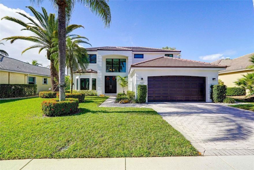 Live in style in this lovely, extremely well maintained 5 Bedroom, 3 full Bath home, NEW ROOF, NEW IMPACT WINDOWS 2023, 2 NEW AC, New Exterior paint, newer water heather. One bedroom on first floor. Walk in and fell right at home in this charming and spacious home. "A" rated schools 24/hr guard gate and security patrol,a park and backetball court very close to the property