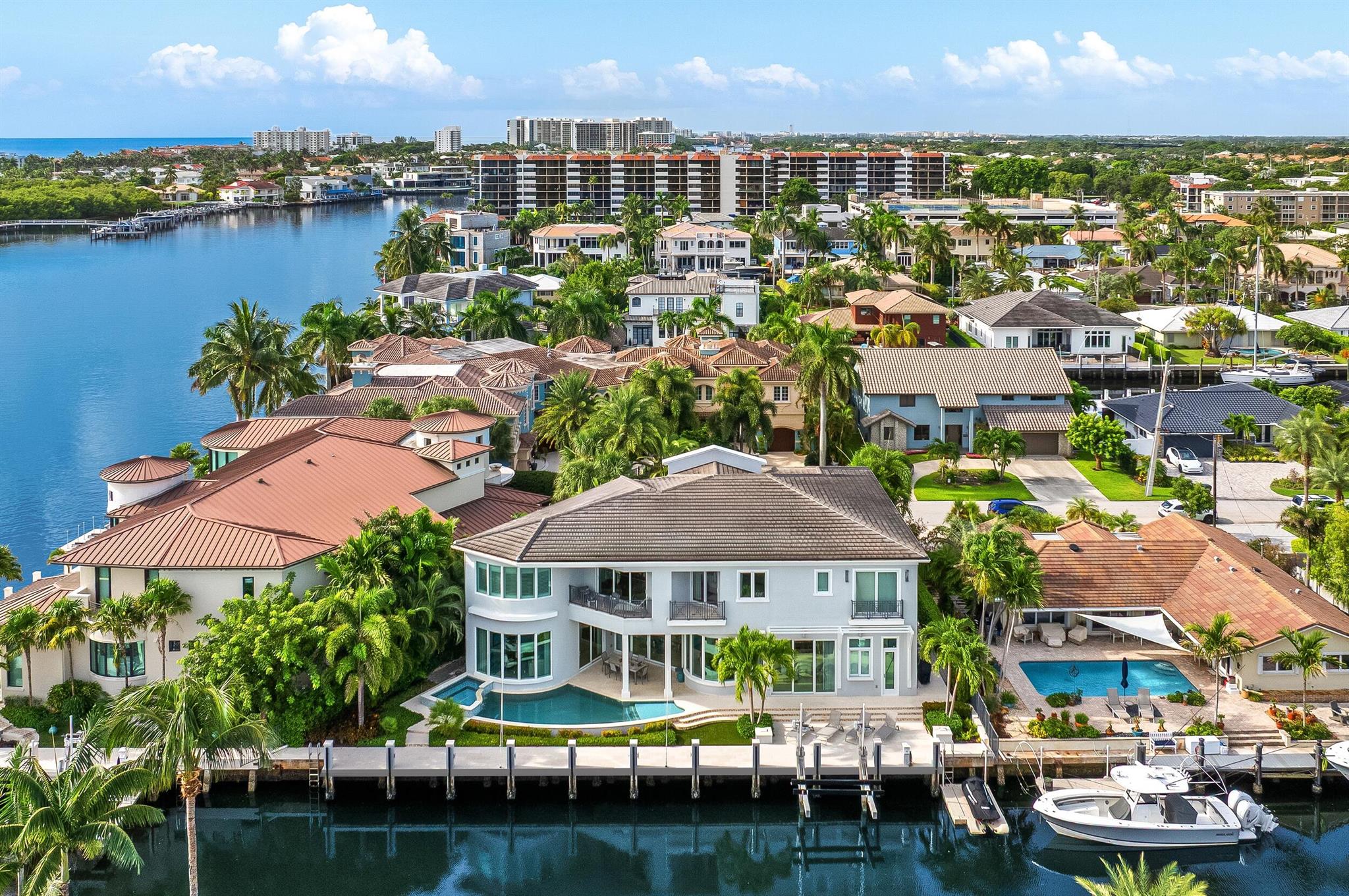 A rare offering from the esteemed Mary Widmer Luxury Collection, this modern West Indies estate epitomizes the height of waterfront living in Boca Raton. Set on a lushly landscaped 7,853-square-foot lot, this stunning residence, built in 2018, offers 120 feet of deep-dredged waterfront on an interior canal, just one property removed from the Intracoastal Waterway with direct ocean access. With over 5,600 square feet of air-conditioned living space and more than 6,700 total square feet, this meticulously crafted home blends sleek architectural lines with timeless coastal elegance, creating a sanctuary that is both a visual masterpiece and a haven of luxury.