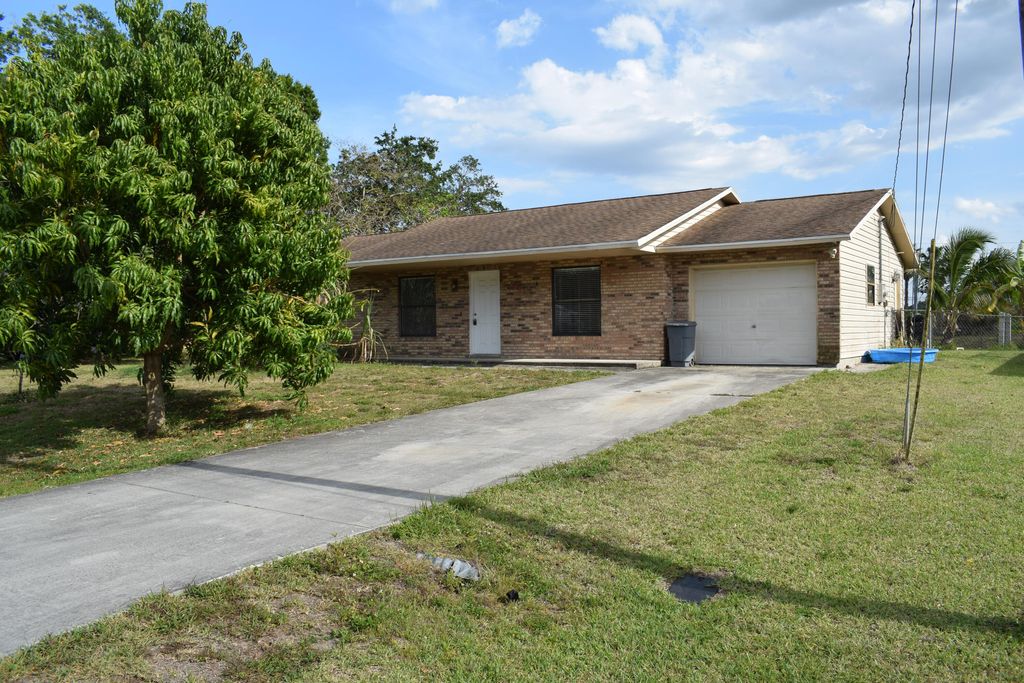 Photo of 2541 SW National Circle, Port Saint Lucie, FL 34953 (MLS # R10795489)