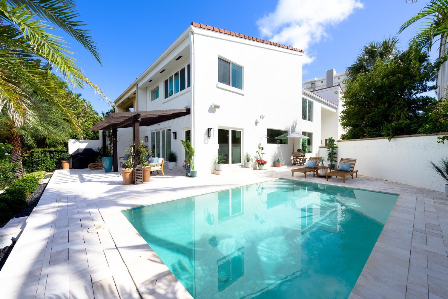 This completely remodeled waterfront estate offers luxurious living with modern high-end finishes and top-tier appliances. Situated on a private deep-water canal with a width of 150 feet, the home boasts 50 feet of uninterrupted views of the Intracoastal. Spanning 4,222 square feet, the residence features 4 bedrooms and 3.5 bathrooms, all within a spacious layout designed to capture breathtaking water views from the moment you enter. Located close to both the Boca Raton and Delray Beach inlets for easy ocean access, this home is also conveniently near Downtown Delray Beach and Boca Raton, as well as major highways and airports. This home also has a deeded beach access.