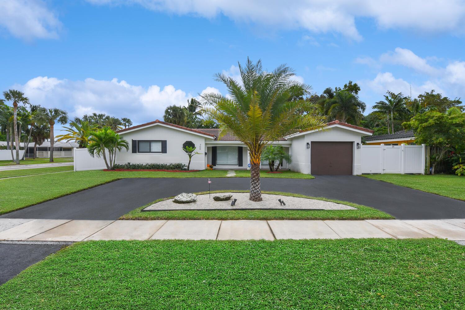 Renovated East Boca pool home on a fenced corner lot w sidewalks in highly desirable Royal Oak Hills AND Addison Mizner Elementary school district. Recently renovated with a circle driveway features 3 bedrooms, 2 baths plus an office and a large family room. features open kitchen with white shaker cabinets w black hardware & quartz counters and bar seating for 8. LG stainless appliances including fridge with window in door, slide in island oven with double stove & premium LG dishwasher. Beautifully renovated bathrooms feature designer tile, seamless glass, black hardware & light fixtures. Luxury vinyl plank flooring throughout, plantation shutters & zebra roller blinds throughout, Hurricane impact windows & doors 2022, Tile roof 2011, A/C 2014, hot water heater