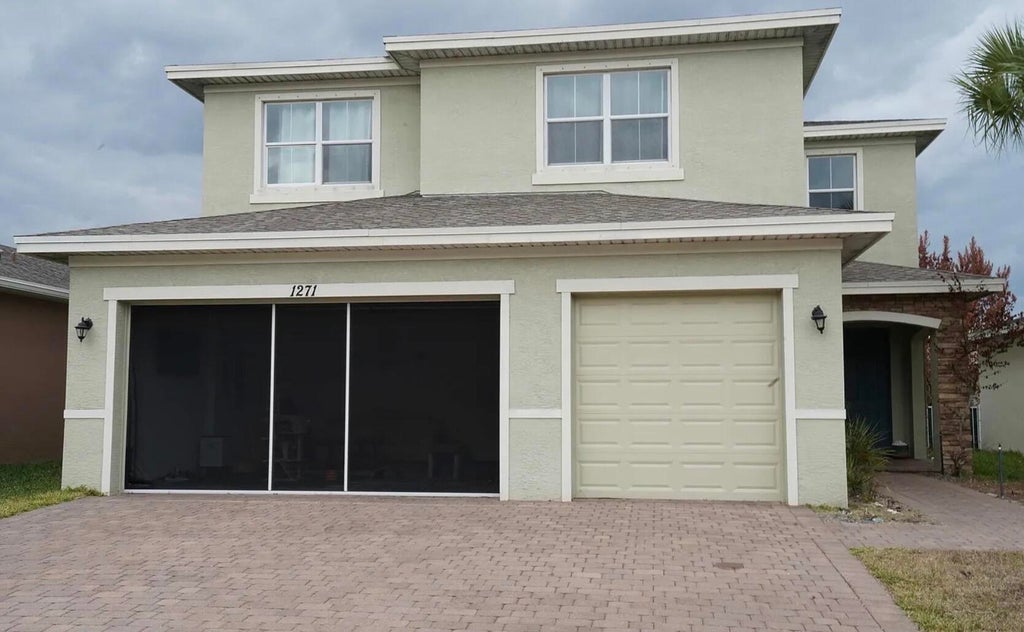 Photo of 1271 NW Leonardo Circle, Port Saint Lucie, FL 34986 (MLS # B26041168)