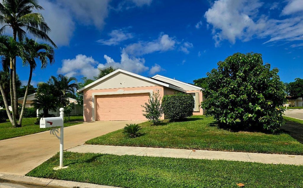 Photo of 1213 PINE SAGE Circle, West Palm Beach, FL 33409 (MLS # B26093003)