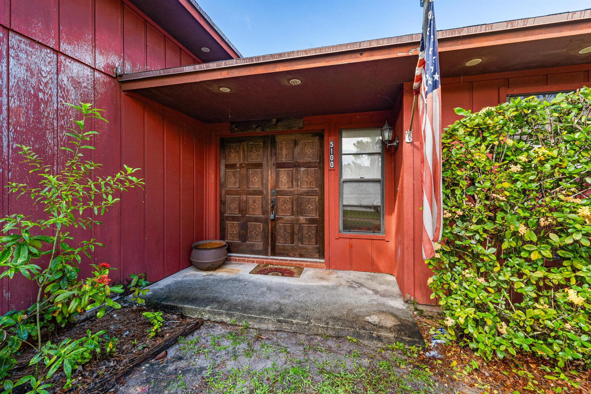 Step back in time--in the best way possible! This 1983-built gem is a true time capsule of the '80s, with endless potential to transform into your dream home. The spacious layout feels larger than life, featuring soaring volume ceilings and a massive 15x19 living room that could easily expand even further. The double front doors open to a grand entry with Spanish tile, setting the stage for retro charm. The screened and covered patio connects the kitchen, living room, and primary suite for indoor-outdoor flow. The 2-car garage comes with surprises: a large utility/mudroom and TWO bonus rooms, including an air-conditioned office. Sitting on over 1/2 acre corner lot, with well and septic, this property is as solid as they come--completely livable but ready for a full makeover to bring it int