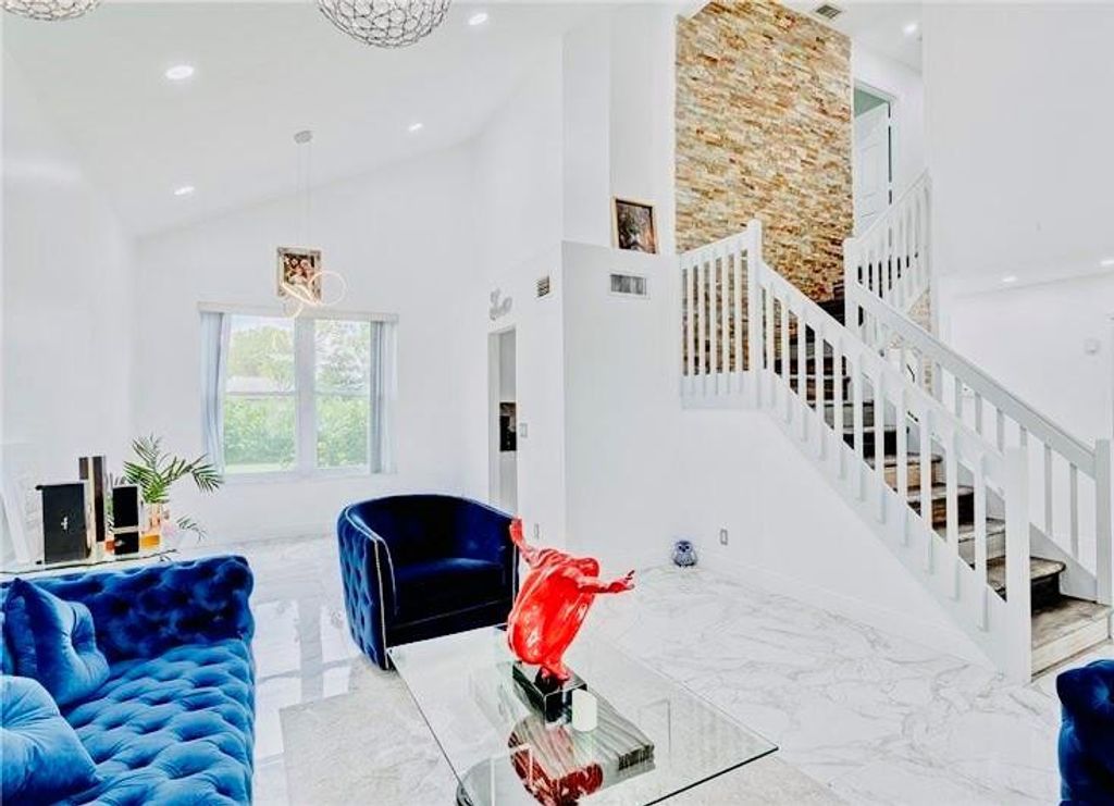 Photo of 128 N Royal Pine Circle, Royal Palm Beach, FL 33411 (MLS # F10539778)