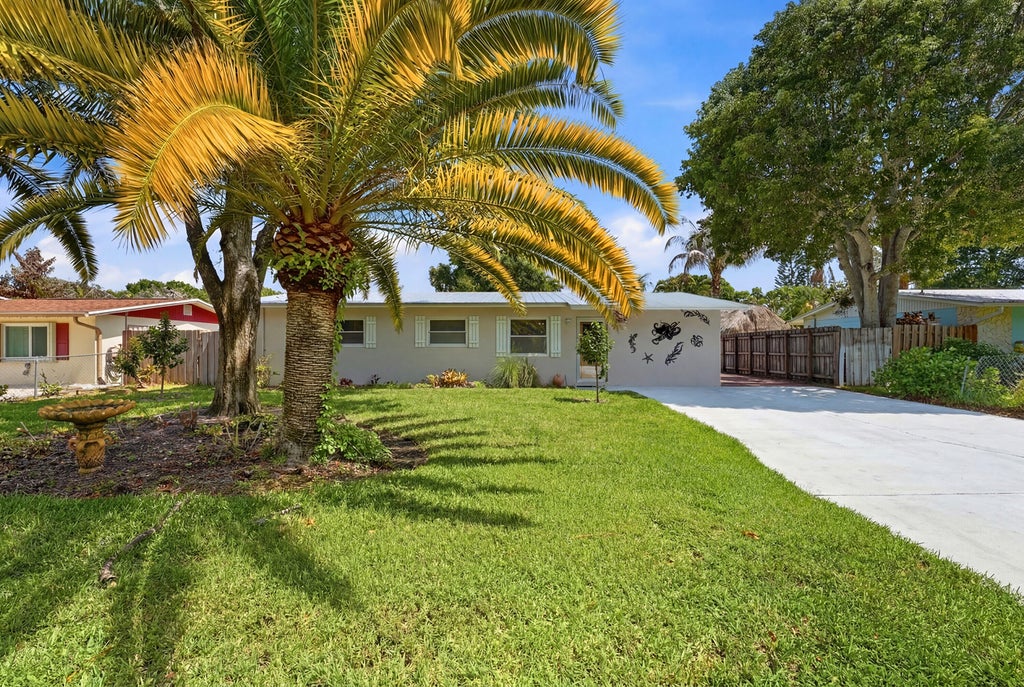 Photo of 1095 NE Tuxedo Terrace, Jensen Beach, FL 34957 (MLS # B26044407)