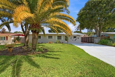 Photo of 1095 NE Tuxedo Terrace, Jensen Beach, FL 34957 (MLS # B26044407)
