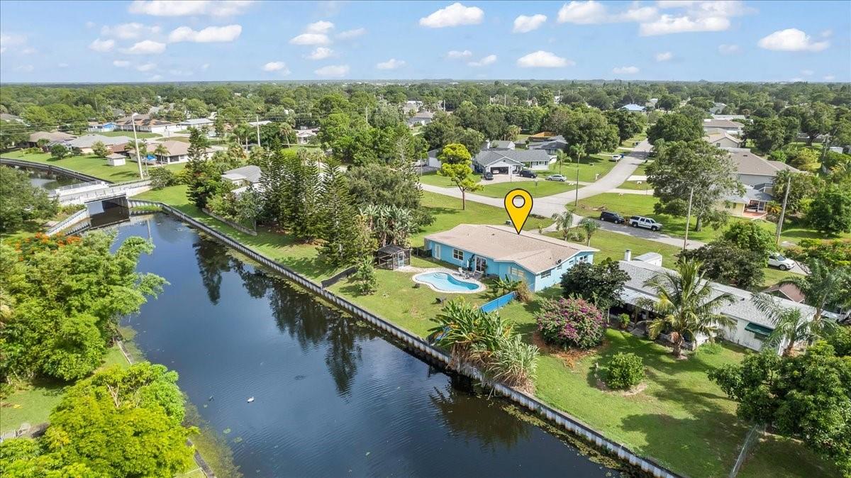 Discover your dream waterfront lifestyle in this completely remodeled concrete block pool home in Sebastian Highlands! Step inside and be wowed by the chef's kitchen, featuring gleaming granite countertops, 42" cabinets, and a convenient walk-in pantry, all complemented by continuous luxury vinyl plank flooring. Outside, a sparkling new pool with a brick paver patio awaits for endless enjoyment. You'll also love the added bonus of fresh fruit from your own avocado, banana, and pineapple trees! Plus, enjoy peace of mind with recent updates including a new septic system (2022), new roof (2021), new A/C (2020), and of course, the new pool (2022).