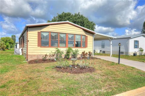 Photo of 705 Hyacinth Circle, Barefoot Bay, FL 32976 (MLS # R11148856)