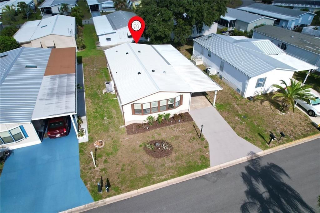 Photo of 705 Hyacinth Circle, Barefoot Bay, FL 32976 (MLS # R11148856)