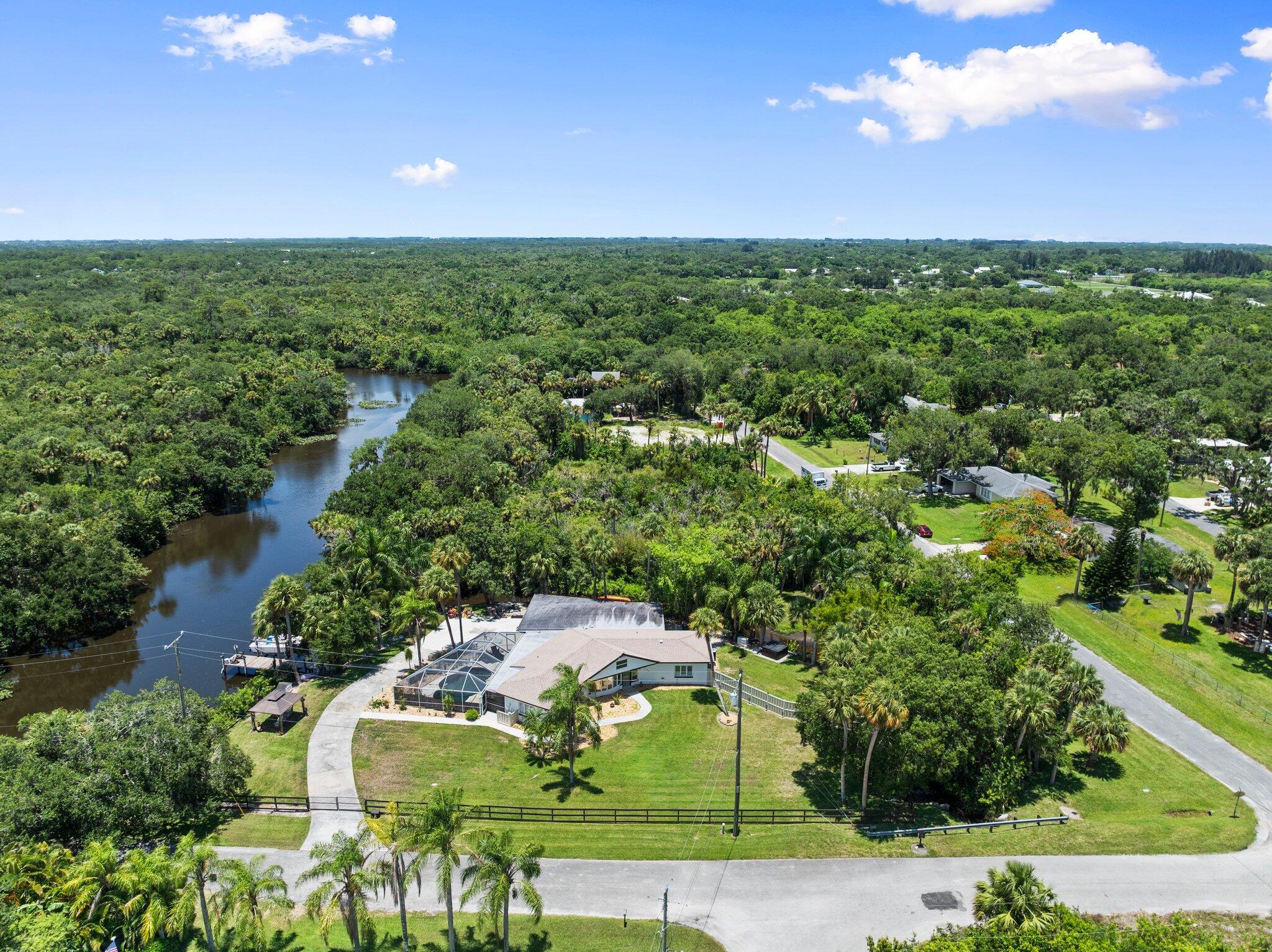 Solid CBS home on nearly 2 acres with river frontage & direct ocean access! Private and serene, this property offers a newer roof, full-home generator, and abundant wildlife all around. In less than 40 minutes, reach open water--boat to restaurants, the sandbar, or your neighbor's dock. Enjoy kayaking, fishing, or watching manatees and playful otters from your backyard. A charming Free Reading Library (#FRL) lets you trade books, sit on the bench, and take in nature. With space to garden, relax, or simply spread out, this rare CBS gem blends comfort, privacy, and the ultimate Florida lifestyle.