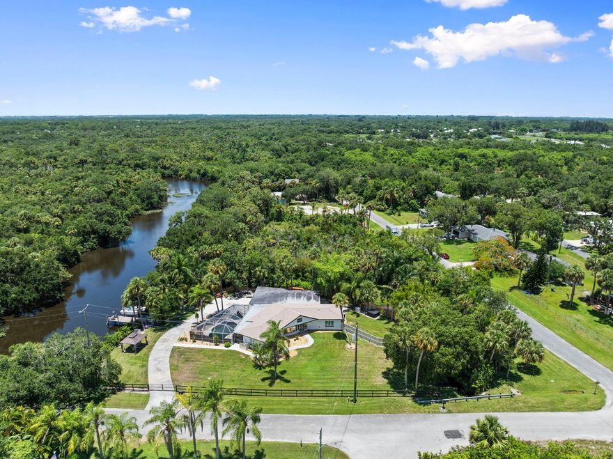 Solid CBS home on nearly 2 acres with river frontage & direct ocean access! Private and serene, this property offers a newer roof, full-home generator, and abundant wildlife all around. In less than 40 minutes, reach open water--boat to restaurants, the sandbar, or your neighbor's dock. Enjoy kayaking, fishing, or watching manatees and playful otters from your backyard. A charming Free Reading Library (#FRL) lets you trade books, sit on the bench, and take in nature. With space to garden, relax, or simply spread out, this rare CBS gem blends comfort, privacy, and the ultimate Florida lifestyle.