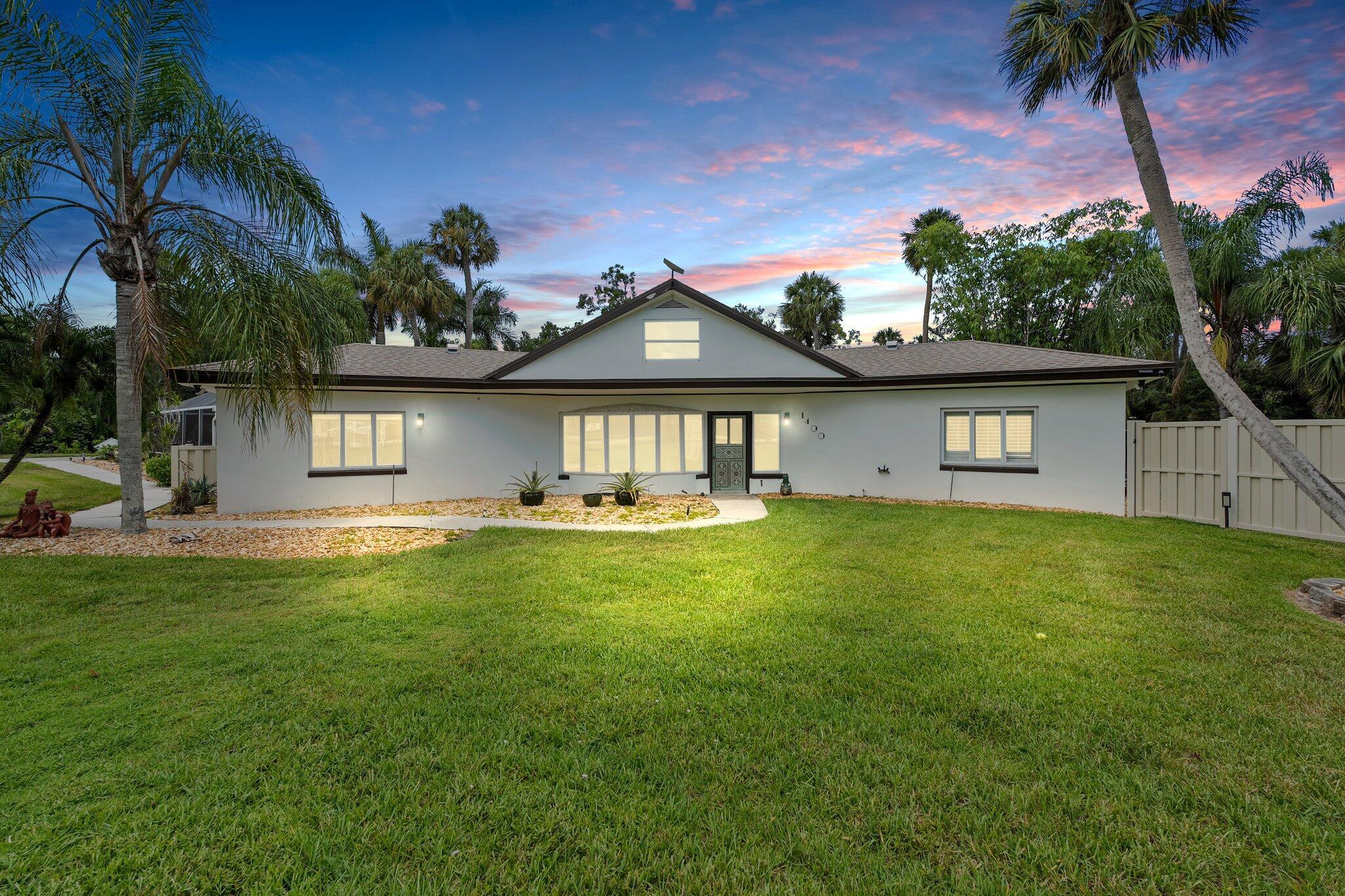 Rare waterfront retreat on nearly 2 private acres with 142+ ft on the St. Lucie River! Boater's dream with 12,000 lb lift, dock, ocean access, and 500-gal gas tank. Inside, enjoy a massive chef's kitchen with gas stove, double ovens, and prep space for entertaining. CBS construction and a private guest/in-law suite with separate entrance. Peaceful, secluded, and built for the ultimate Florida lifestyle!