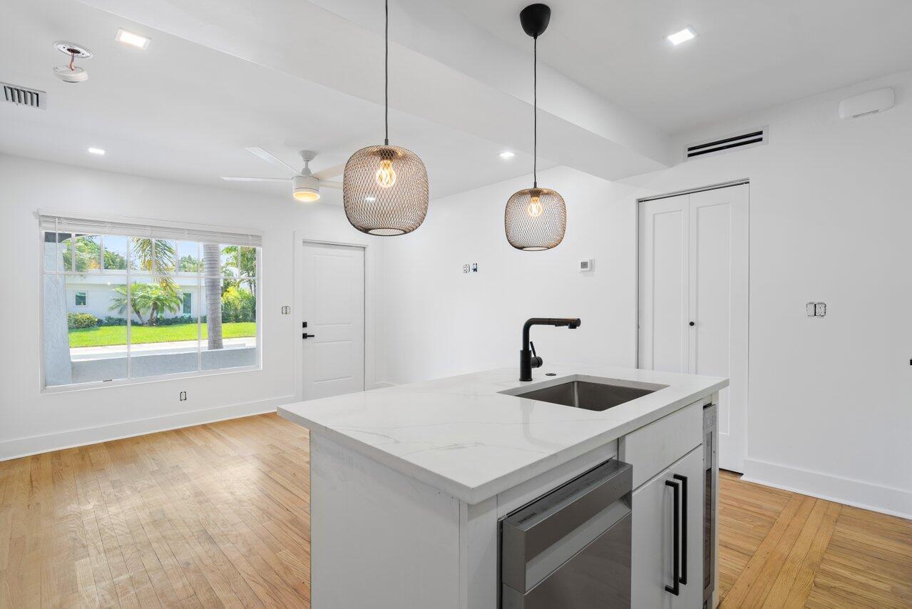 Discover Pineapple Grove Apartments, a charming 8-unit Spanish Revival building with lush tropical landscaping. Within it sits your dream one-bedroom apartment in the vibrant Pineapple Grove neighborhood of Delray Beach. This residence perfectly blends historic character and modern luxury. Inside you'll find real hardwood floors, central air, brand new appliances, an in-unit washer and dryer for your convenience, impact windows, covered patio & much more. The bright inviting space is filled with natural light, and the thoughtfully designed layout ensures both comfort and ease. Just steps away from the eclectic mix of boutiques, art galleries and gourmet dining options in Pineapple Grove, you'll enjoy the best of Delray Beach living. Only first & security required with good income & credit