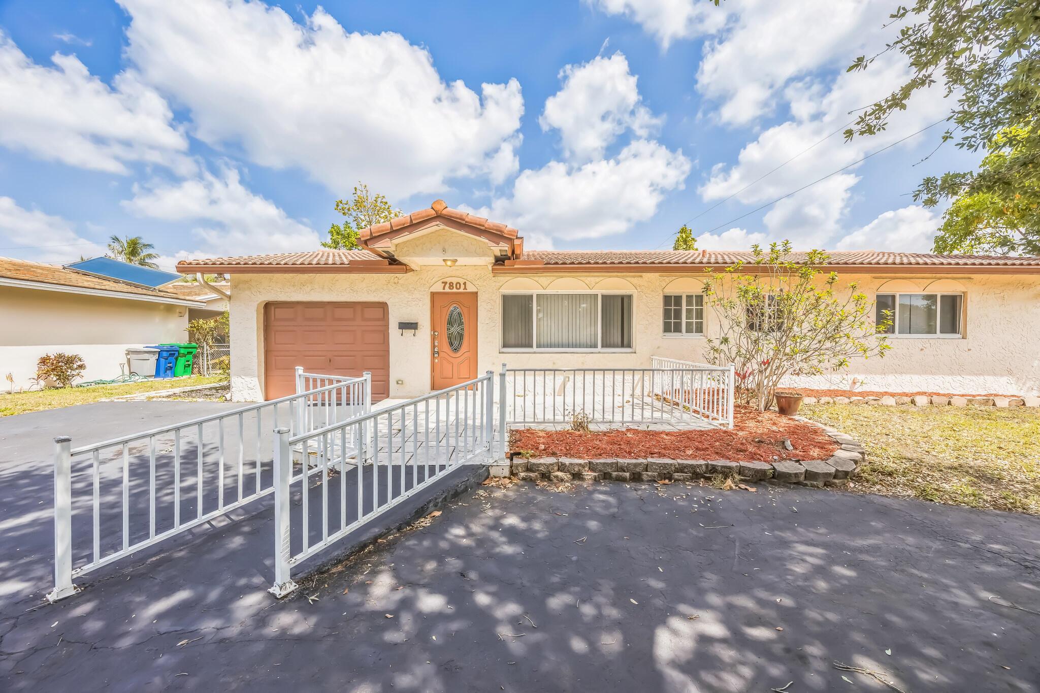 Spacious and inviting, this 4-bed, 3.5-bath home in Coral Springs offers 2,593 sq. ft. of living space on a 7,500 sq. ft. lot--perfect for entertaining! Enjoy a large living room, a family room with a bar, and a recently updated kitchen featuring granite countertops and stainless steel appliances. Impact windows provide peace of mind, while the one-car garage and large circular driveway offer ample parking. Built in 1970, this charming home blends classic character with modern upgrades. Don't miss this gem!