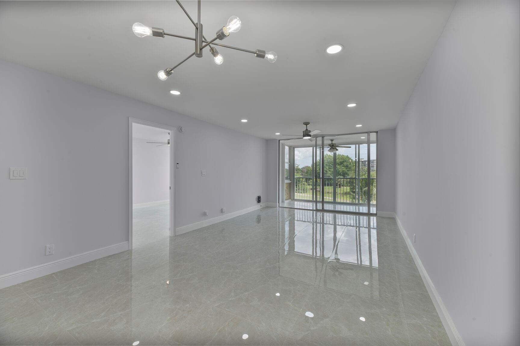 Beautifully updated 1 bedroom, 1 and a 1/2 bath condo located in the sought-after Palm-Aire community. This light-filled unit offers a blend of comfort, style, convenience, and an open layout- with elegant finishes, including quartz countertops, ALL NEW light fixtures, modern cabinetry, stainless steel appliances, and neutral porcelain tile fl throughout. Enjoy peaceful mornings or sunset evenings on your private screened balcony overlooking the lush greenery of the golf course. The spacious bedroom features generous closet space, and the upgraded bathroom adds a touch of contemporary charm. Ideally located just minutes from the beach, shopping, dining, and major highways- this is South Florida living at its best! Perfect as a year-round residence or vacation getaway. 700 m score as per CA