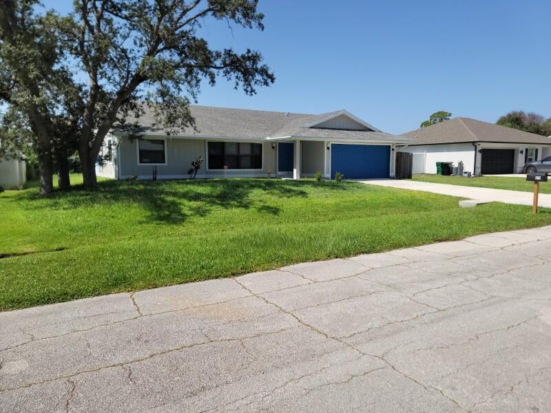 Photo of 974 SE BELFAST Avenue, Port Saint Lucie, FL 34983 (MLS # B26054695)
