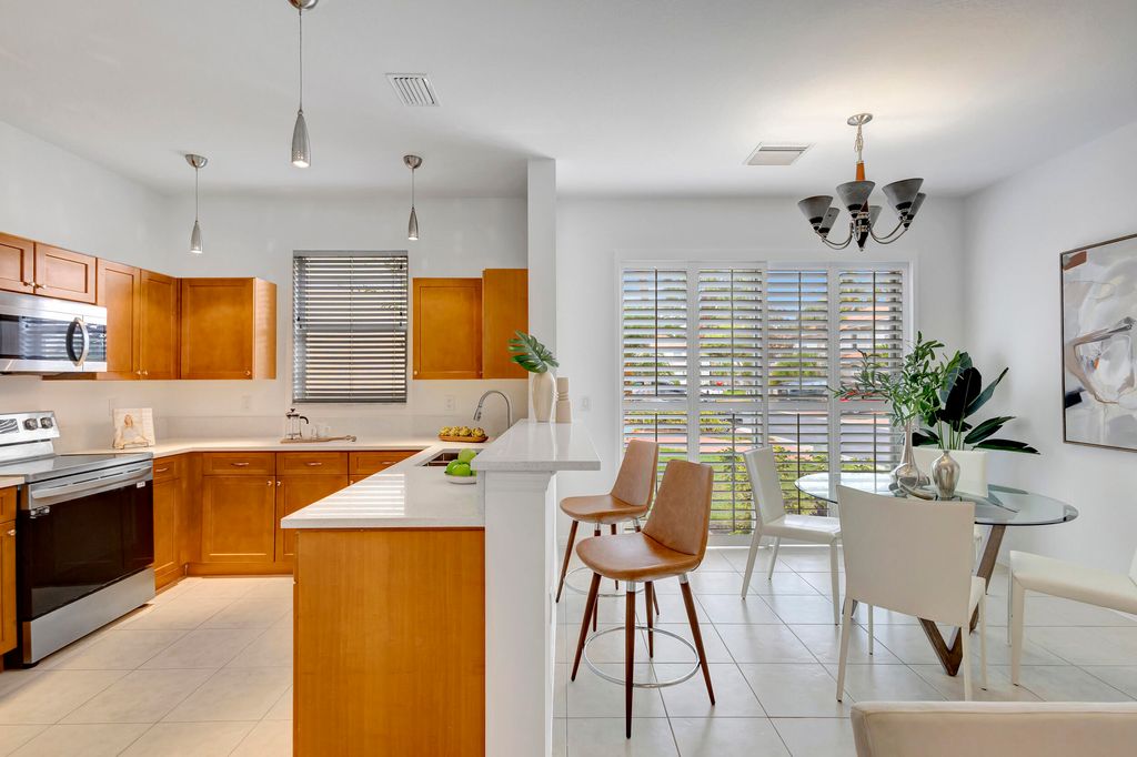 Photo of 6110 Seminole Gardens Circle, Riviera Beach, FL 33418 (MLS # R10942138)