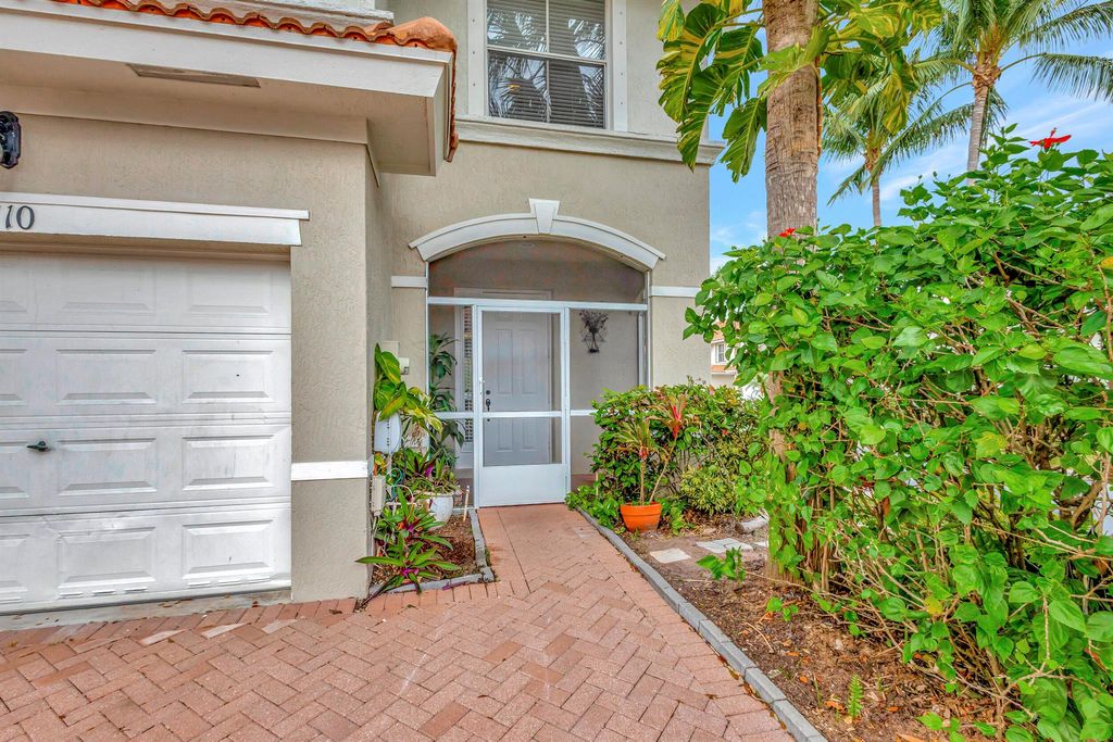 Photo of 6110 Seminole Gardens Circle, Riviera Beach, FL 33418 (MLS # R10942138)