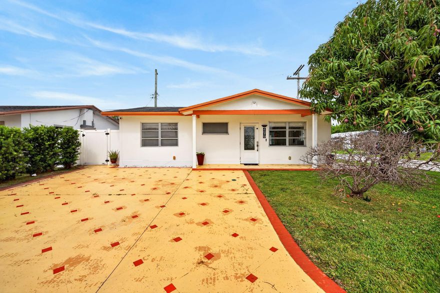 Step into this inviting 2-bedroom, 2-bath home, situated in a family oriented community. Featuring stainless steel appliances, an island, & granite countertops in the kitchen. Take advantage of a dedicated laundry room complete with a sink & newer washer/dryer, in addition to the peace of mind provided by a roof from 2016 & HVAC from 2025. Located on a desirable corner lot, the home provides two driveways that can accommodate 3 vehicles. Enjoy relaxation in your private, poly-fenced backyard patio or under your very own mango tree. Situated in a serene, well-maintained community, it includes a spacious clubhouse, pool, & guest parking all just a short walk away. Additionally, it is near Tamarac Preserve Park, which offers various outdoor activities. Close to beach, highways, airport & more