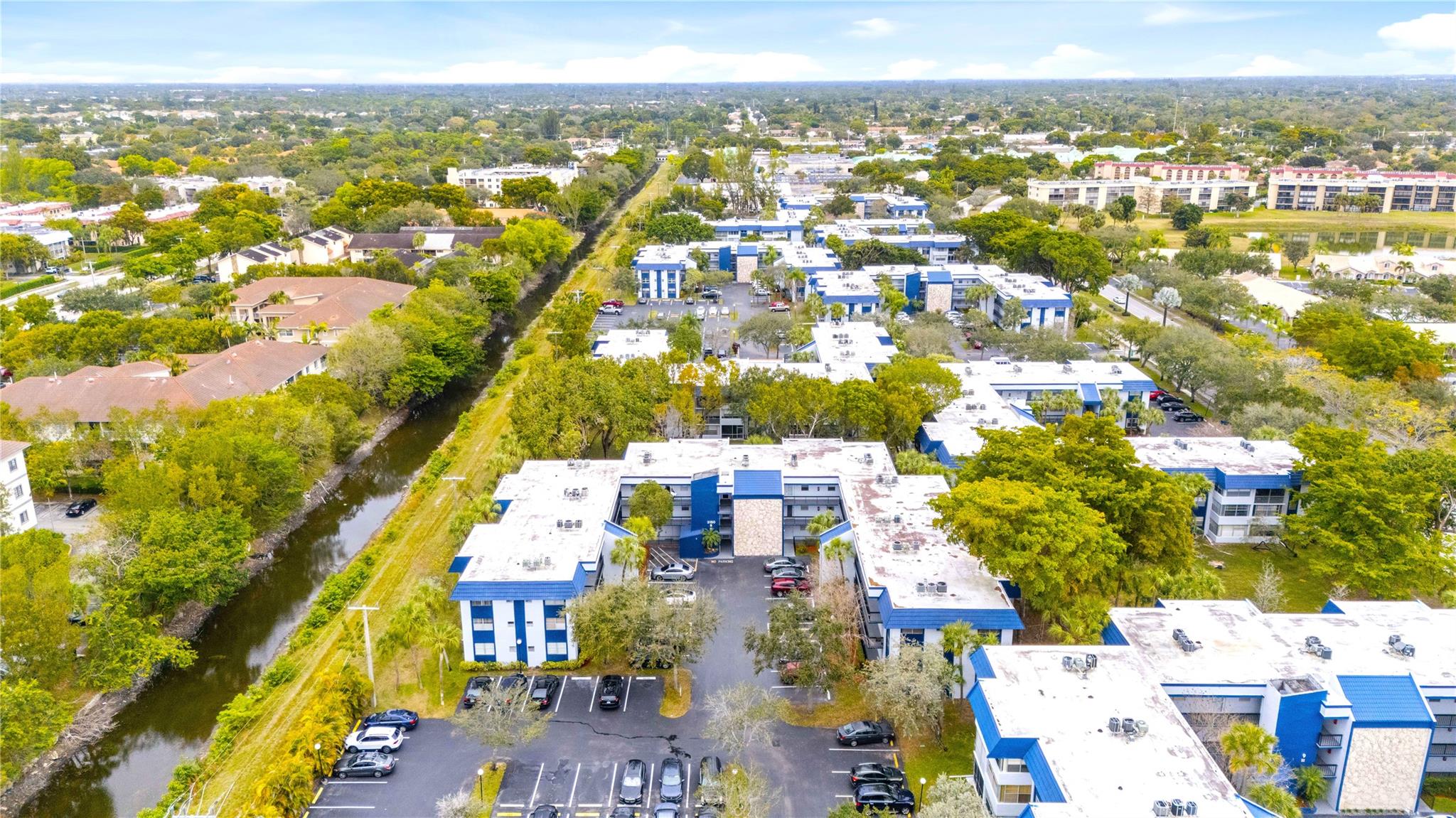 This delightful 2-bed 2-bath corner unit condo is located close to the Clubhouse, which features a playhouse, library, huge heated pool, sauna, tennis courts and other amenities. The condo has been lovingly occupied and is now ready to welcome its next owner. Enjoy sunsets from your 3rd floor north-facing balcony with views of the Stranahan River canal. Holiday Springs Village is a resort-style 55+ community located in Margate, a thriving city with parks and golf courses. The annual Fall Festival is a must do. This unit is well-priced and easy to show.