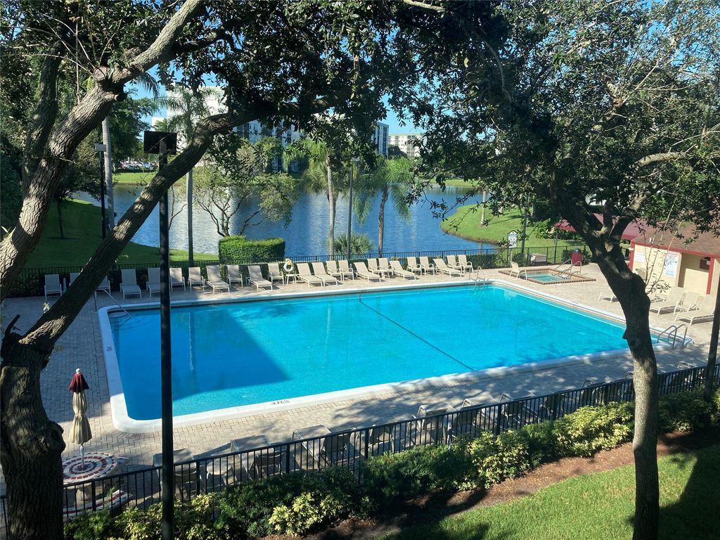 Photo of 2216 N Cypress Bend Dr #301, Pompano Beach, FL 33069 (MLS # F10404834)