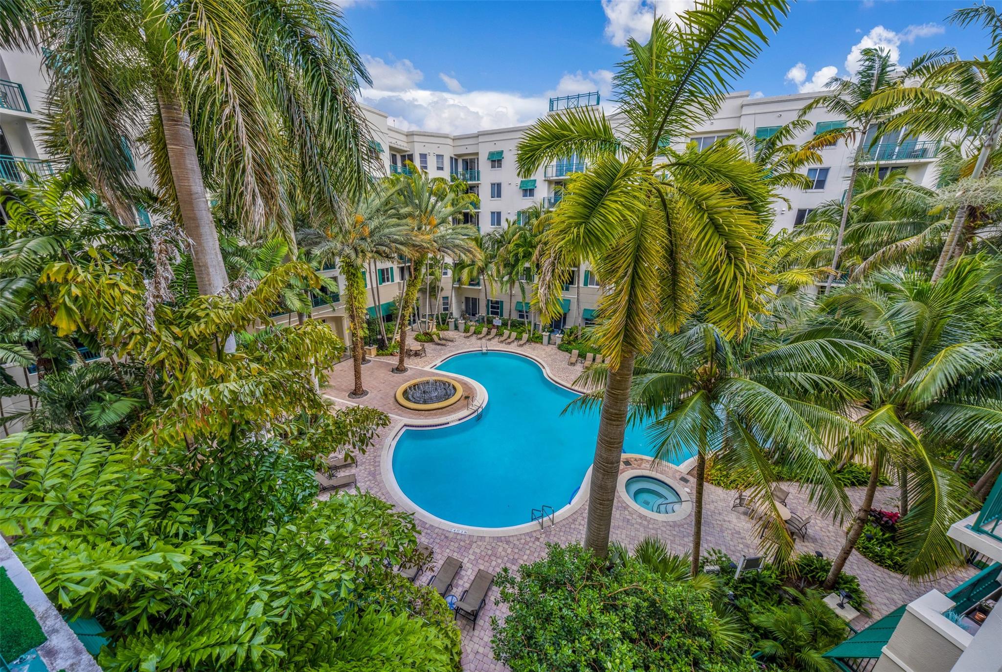 Welcome to resort-style living in the heart of Plantation!
This stunning 2-bedroom, 2-bath residence features a bright and spacious layout with laminate wood floors, marble bathrooms, granite countertops, and stainless steel appliances. Enjoy peaceful pool views from your private veranda, surrounded by lush tropical landscaping and a serene 2-acre lake. The Veranda at Plantation offers 24/7 concierge service, a stylish club room, a fitness center, and a resort-style pool perfect for relaxing year-round. The unit includes 2 assigned parking spaces in a secure garage and an in-unit washer & dryer for added convenience. Perfectly located next to a shopping plaza and restaurants, this home offers the ideal mix of comfort and convenience