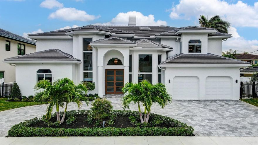 Breathtaking 4BR/3+1BA/2CG remodeled pool home offers 80' of waterfrontage w/ no fixed bridges on a wide canal, minutes to 3 inlets & beaches. The dramatic sundrenched two-story living room is awe-inspiring from the second you enter this home. Walls of windows throughout with breathtaking views punctuated by the waterway, pool, landscape & boats as they pass by. Exquisite features: open modern chef's kitchen w/ gas cooktop, great room, spectacular primary wing w/ separate sitting area by the fireplace, 2 office areas, expansive balcony & luxurious spa-bath w/ two walk-in closets. Resort-style, south facing saltwater pool, outdoor living/dining areas. Newer/updated: roof, dock w/ power pedestal, seawall raised, batter pilings, circular driveway, refinished pool & more. Impact windows/doors.