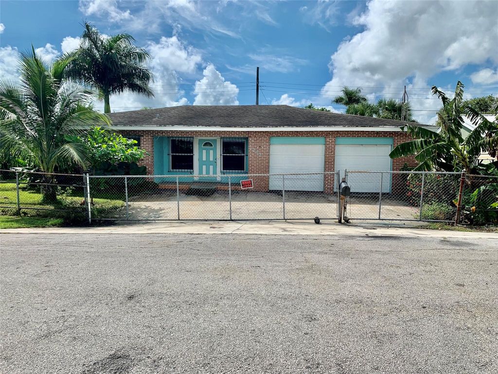 Photo of 1202 W Avenue A, Belle Glade, FL 33430 (MLS # F10402236)