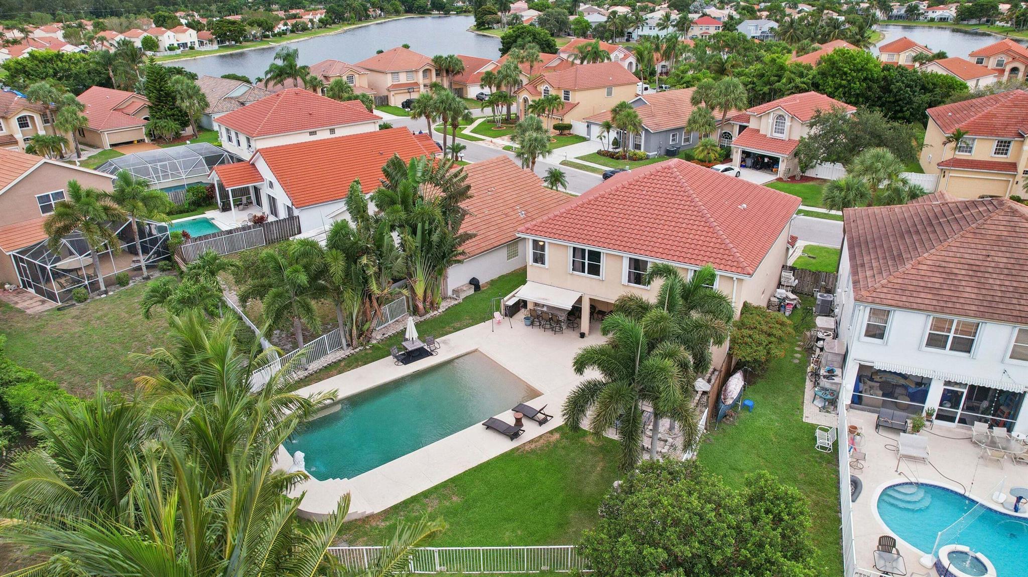 Welcome to your family's dream home! Turn key and fully furnished. This stunning 4-bedroom, 3 1/2-bathroom retreat offers unrivaled luxury with a 40x20 Beach-entry Pool overlooking the serene lake view. Indulge in the jacuzzi tub, entertain at the outside bar with a built-in grill, and retreat to the custom ''MAN CAVE'' garage featuring epoxy floors and a tanning bed. Freshly painted inside and out, this home boasts an oversized living room, family room, and master bedroom with an additional office/den. Complete with a fully operational security camera system, this is the epitome of luxury living. Don't miss your chance to experience the ultimate in comfort and style--schedule a viewing today!