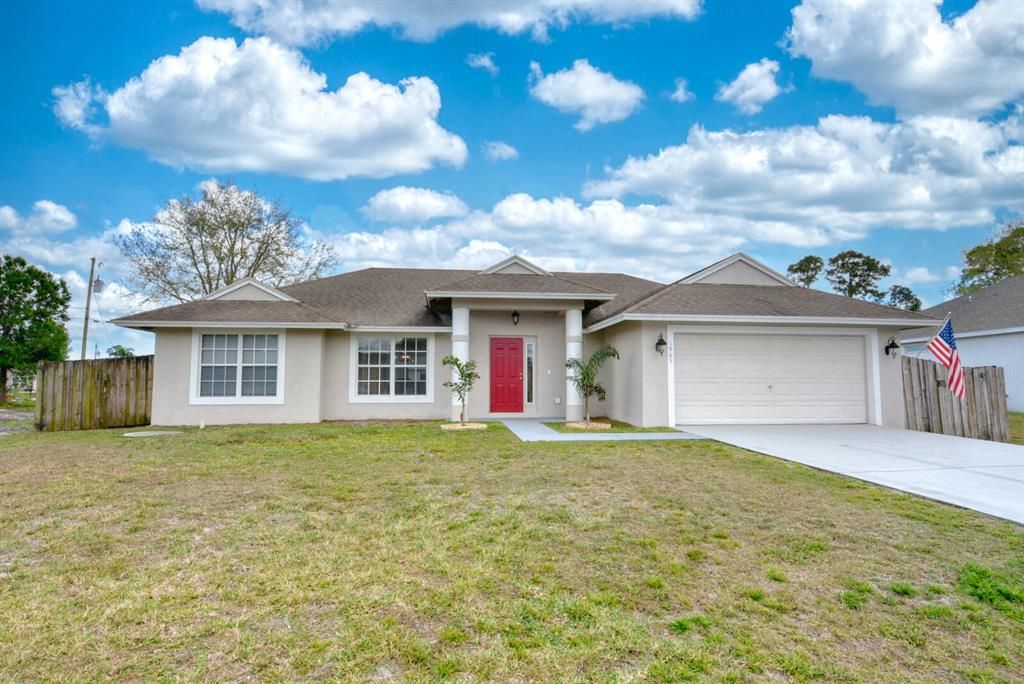 Photo of 1965 SW Hillman Street, Port Saint Lucie, FL 34953 (MLS # R10780354)