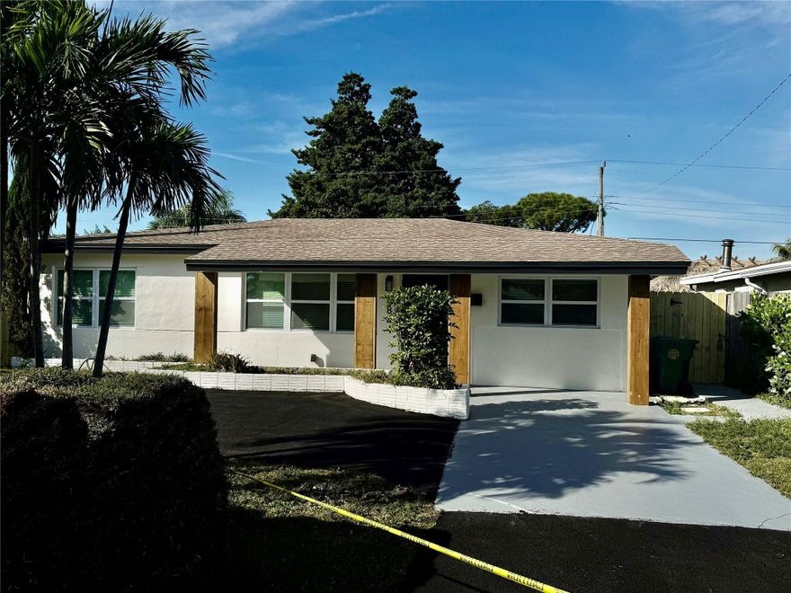 Beautifully renovated 1100 sq ft, 3-bedroom, 2-bath single-family home with circular driveway and cover porch in desirable Oakland Park east of I-95, just minutes to the beach, shopping, Wilton Manors, and major highways. Features an excellent floor plan with a spacious primary suite and private bath. Open-concept kitchen and dining areas are perfect for entertaining and showcase a modern Italian-style kitchen. Large backyard with room for a pool, plus generous front yard and ample parking. Completely updated with new roof, new bathrooms, impact windows and doors, new electrical and plumbing, new A/C, and ceramic tile flooring with wood floors in bedrooms. Fully move-in ready.